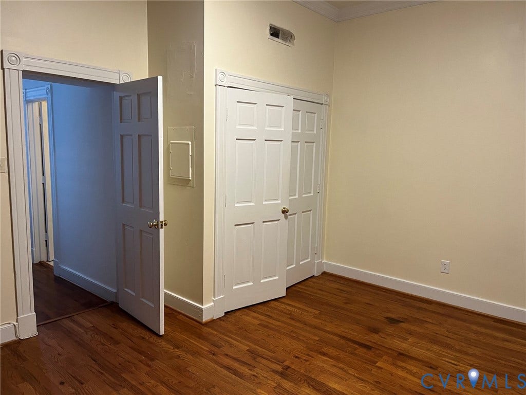 222 W Marshall Street, Jackson Ward, Richmond, VA 23220 Warm wood-finish flooring complements the neutral wall color
