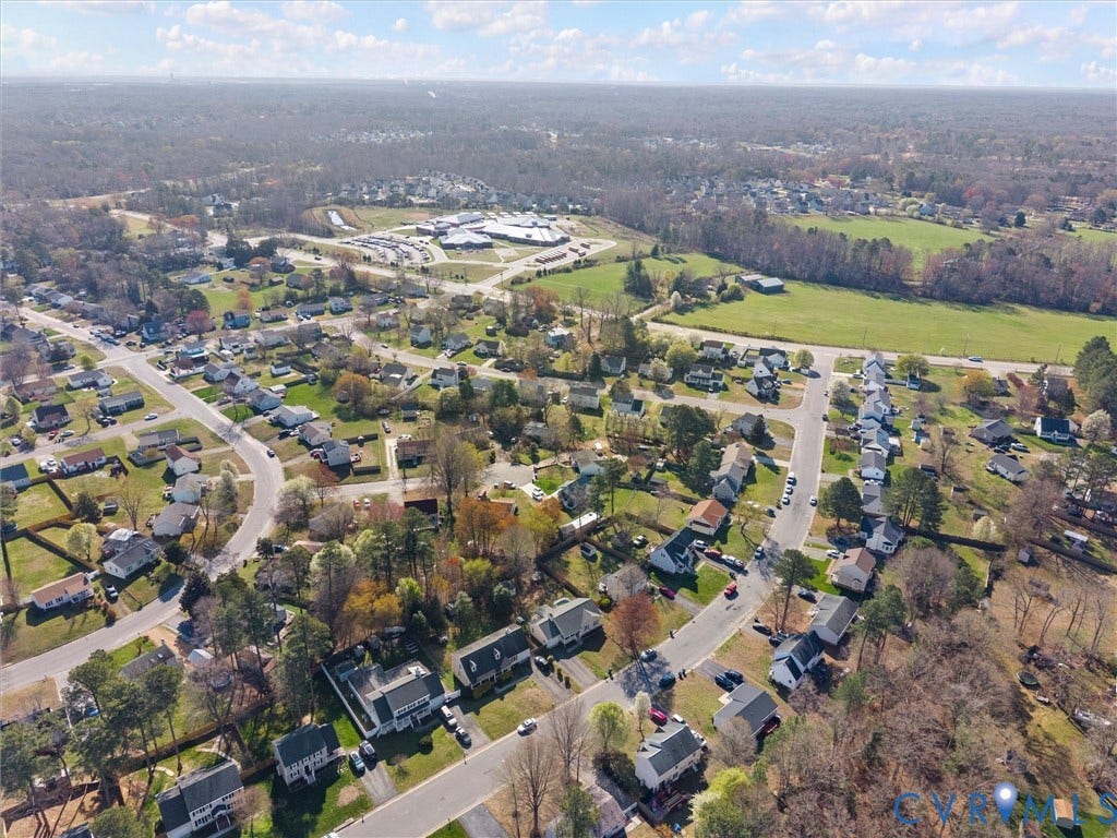 7323 Pineleaf Drive, Chesterfield, VA 23234 Aerial perspective of a residential community featuring established homes, paved streets, and varied landscaping