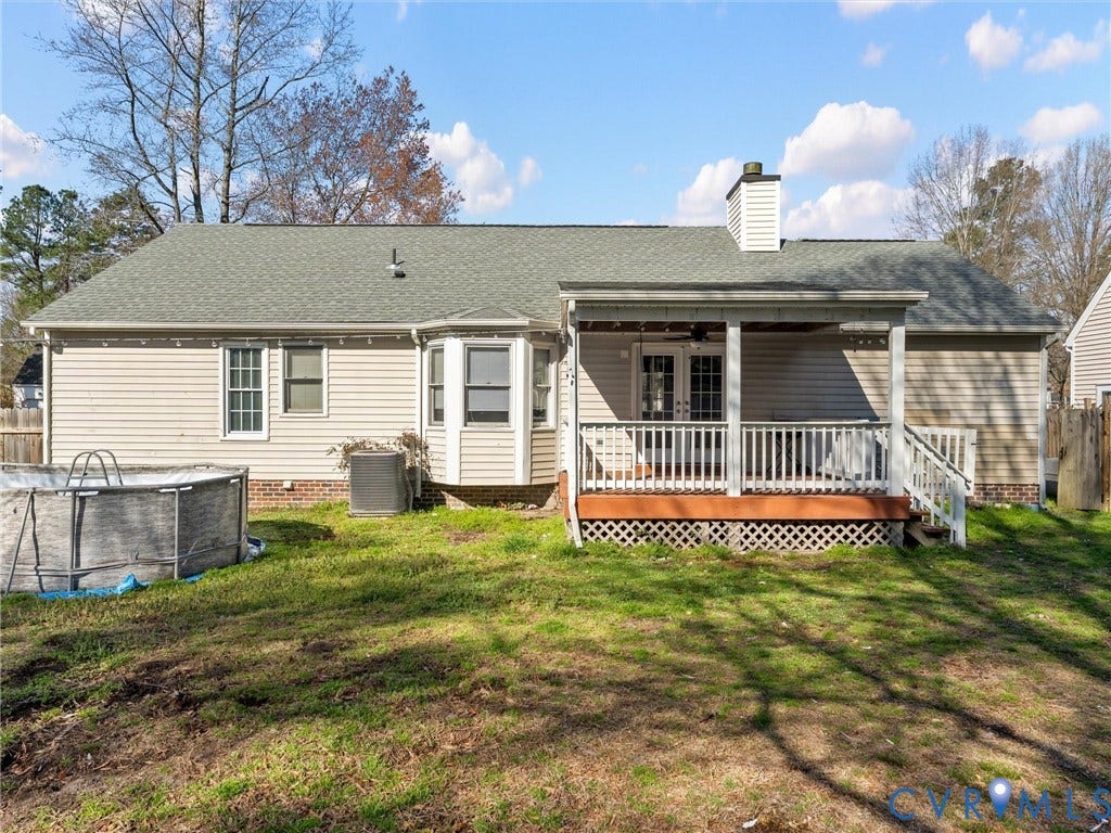 7323 Pineleaf Drive, Chesterfield, VA 23234 Rear exterior featuring a covered deck with white railing, double French doors, and a bay window