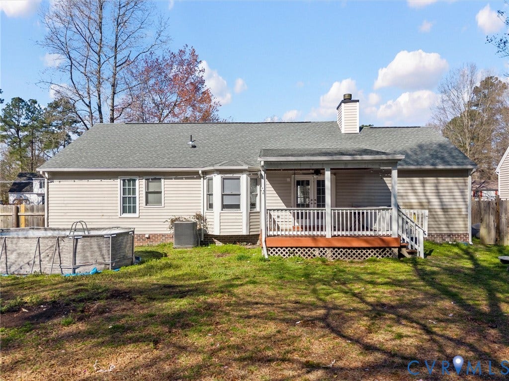 7323 Pineleaf Drive, Chesterfield, VA 23234 Rear exterior with covered porch featuring white railings, providing access to the interior via double glass-paned doors