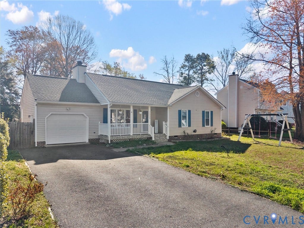 7323 Pineleaf Drive, Chesterfield, VA 23234 Ranch-style residence featuring light-toned siding, a covered front porch with white railings, an attached garage with a white door, and a paved driveway