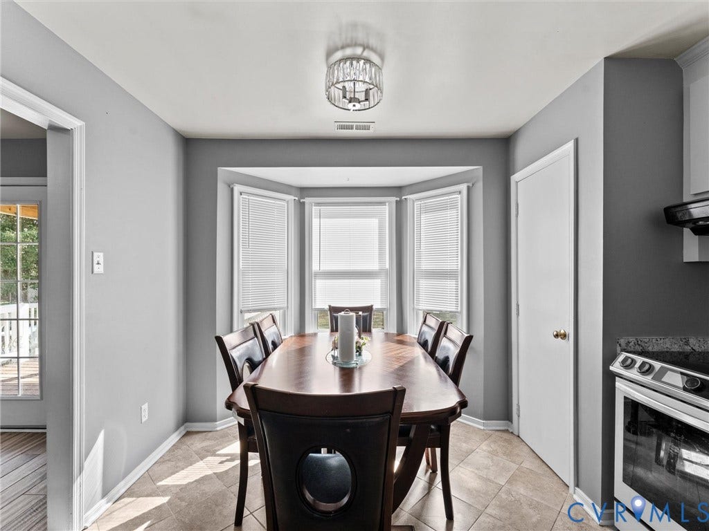 7323 Pineleaf Drive, Chesterfield, VA 23234 Dining area featuring a bay window, recessed lighting, and tile flooring