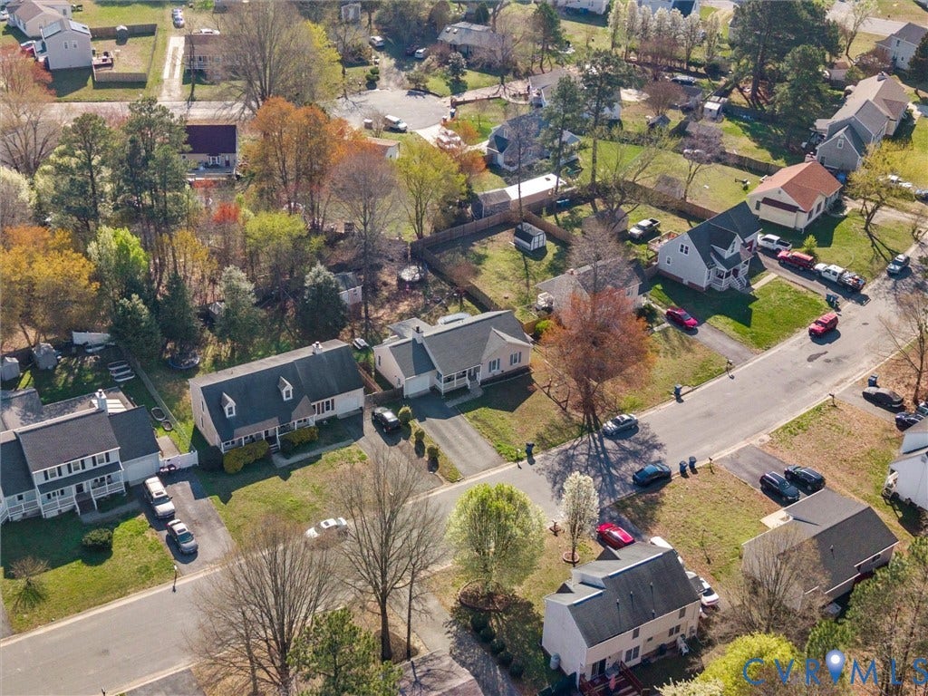 7323 Pineleaf Drive, Chesterfield, VA 23234 Aerial view of a residential street featuring single-family homes with pitched roofs, mature trees, and paved driveways