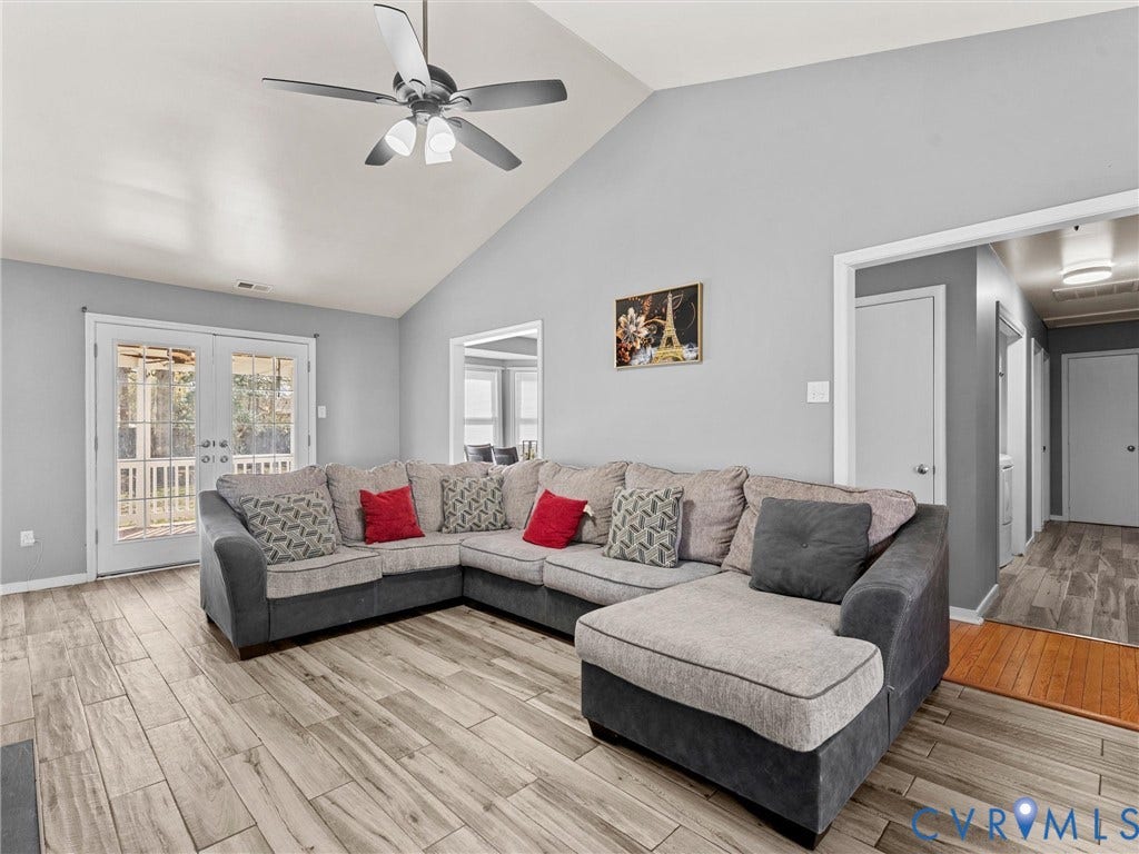 7323 Pineleaf Drive, Chesterfield, VA 23234 Living area featuring vaulted ceilings and a ceiling fan with integrated lighting