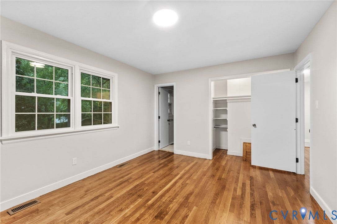 Hardwood flooring complementing light-toned walls