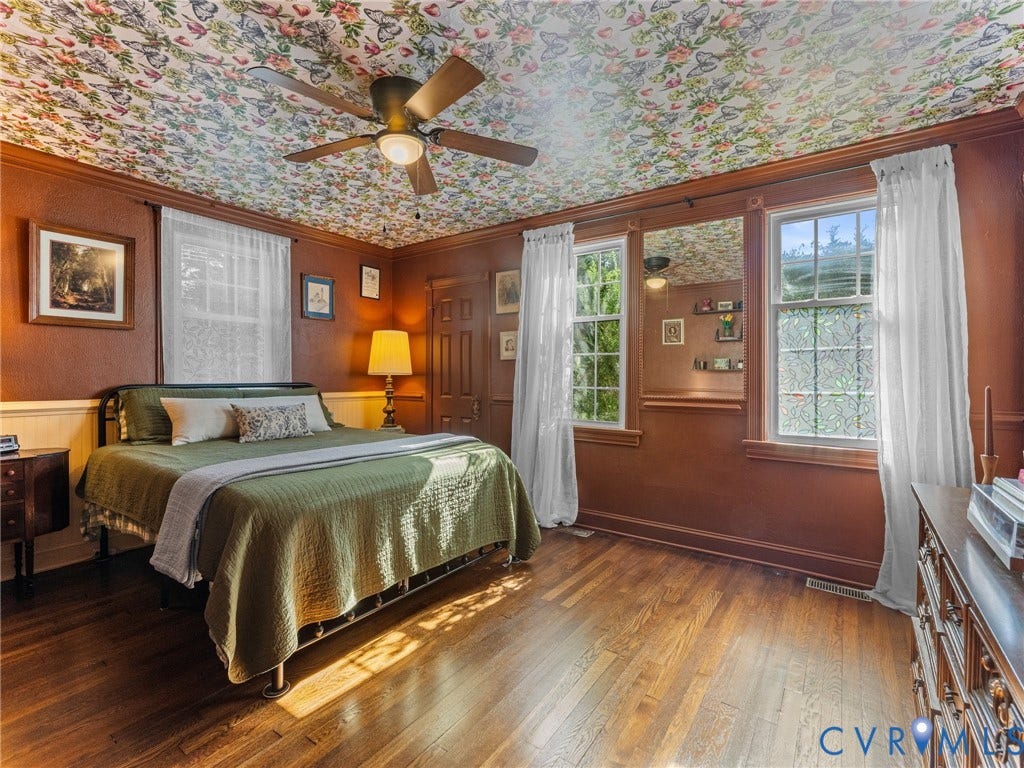 Bedroom featuring wood-finish flooring and a patterned ceiling