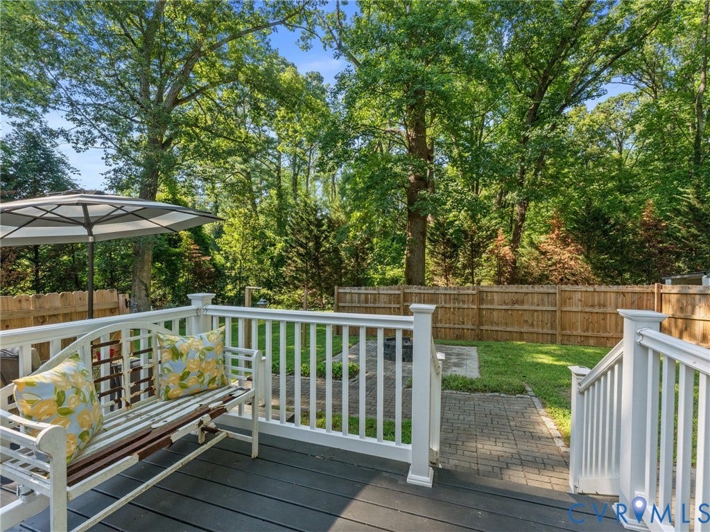 Spacious wood-look deck with white railings