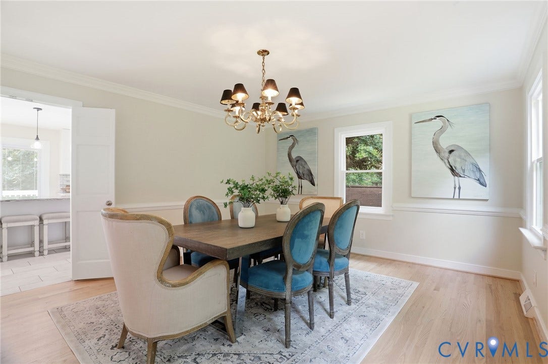 2904 Old Gun Rd W, Old Gun, Midlothian, VA 23113 Formal dining space featuring light wood-finish flooring, a brass chandelier with black shades, and crown molding
