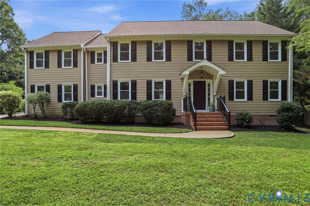 2904 Old Gun Rd W, Old Gun, Midlothian, VA 23113 Two-story residence featuring tan siding, dark shutters, and a covered front entry