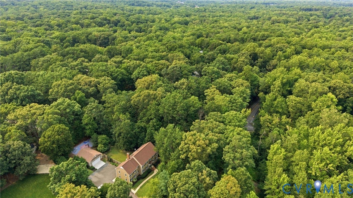 2904 Old Gun Rd W, Old Gun, Midlothian, VA 23113 Aerial perspective showcasing a property surrounded by extensive natural tree cover