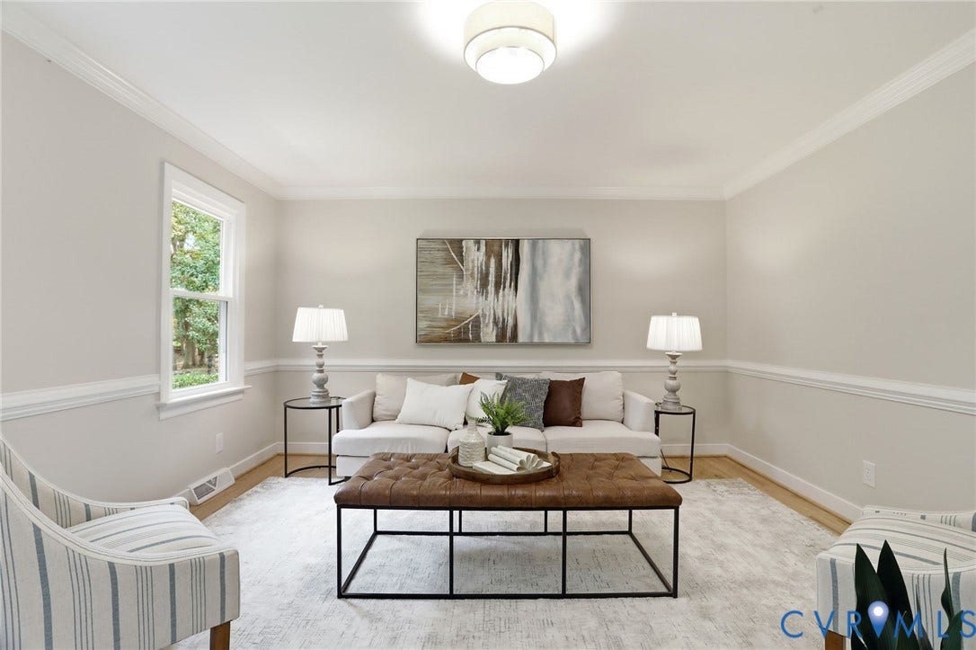 2904 Old Gun Rd W, Old Gun, Midlothian, VA 23113 Bright living space featuring a window with exterior views, crown molding, chair rail detailing, wood-finish flooring, and a flush-mount ceiling light fixture