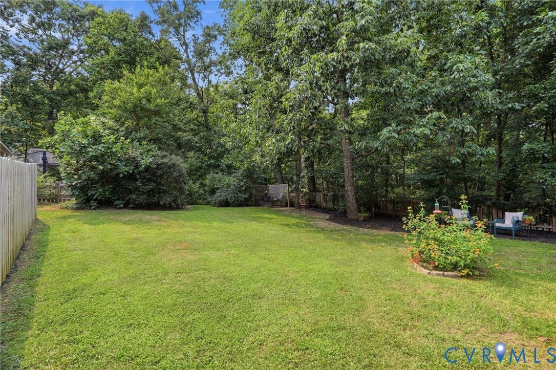 2904 Old Gun Rd W, Old Gun, Midlothian, VA 23113 Spacious grassy yard with a privacy fence on the left perimeter