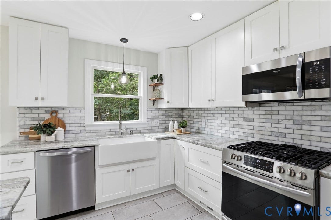 2904 Old Gun Rd W, Old Gun, Midlothian, VA 23113 Kitchen featuring white shaker cabinetry, stainless steel appliances, a farmhouse-style sink, light-toned stone countertops, and a subway tile backsplash