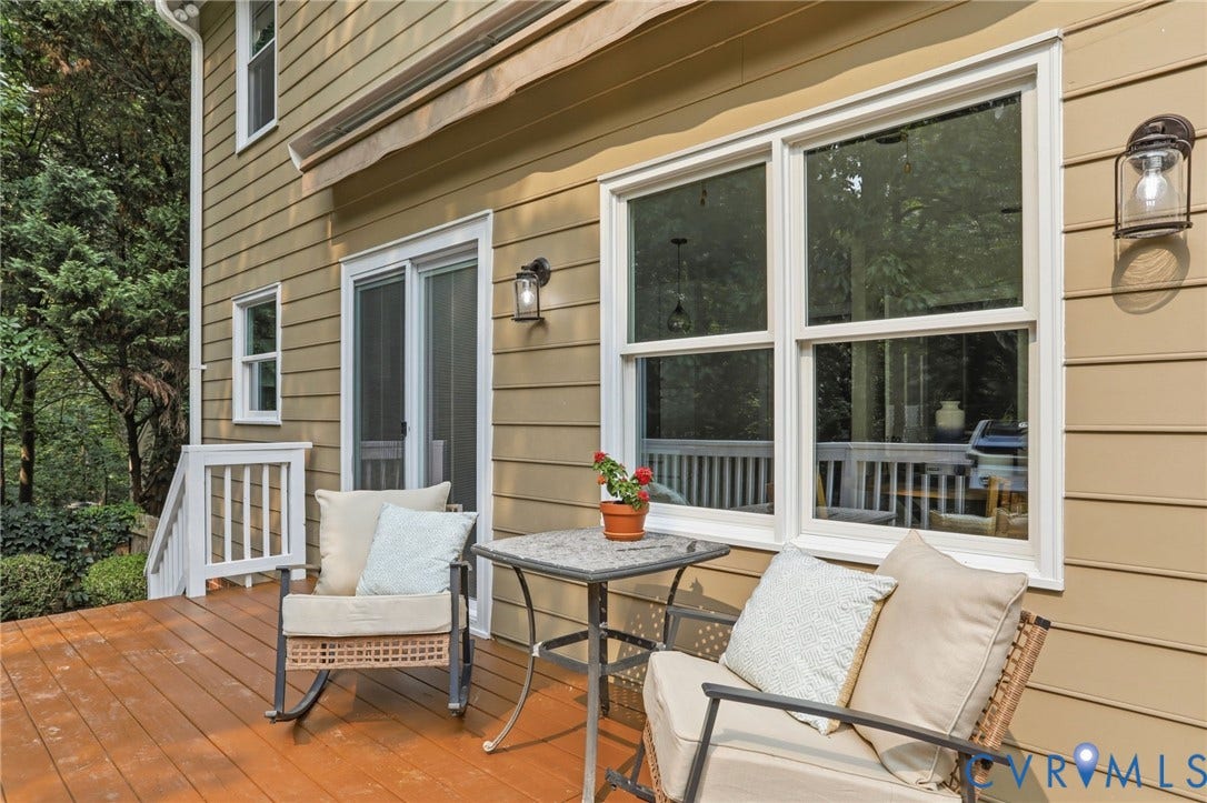 2904 Old Gun Rd W, Old Gun, Midlothian, VA 23113 Expansive outdoor deck featuring wood flooring, white railings, and siding in a natural tone