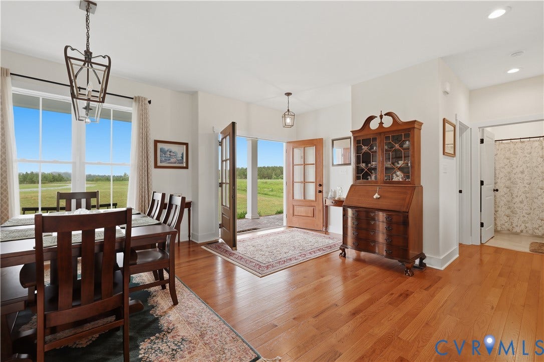 25181 W Soap Stone Rd, Amelia, VA 23083 Hardwood flooring extends throughout the entry and dining area