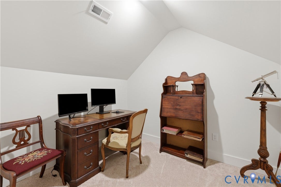 25181 W Soap Stone Rd, Amelia, VA 23083 Carpeted room with sloped ceilings and white walls, featuring a white baseboard trim