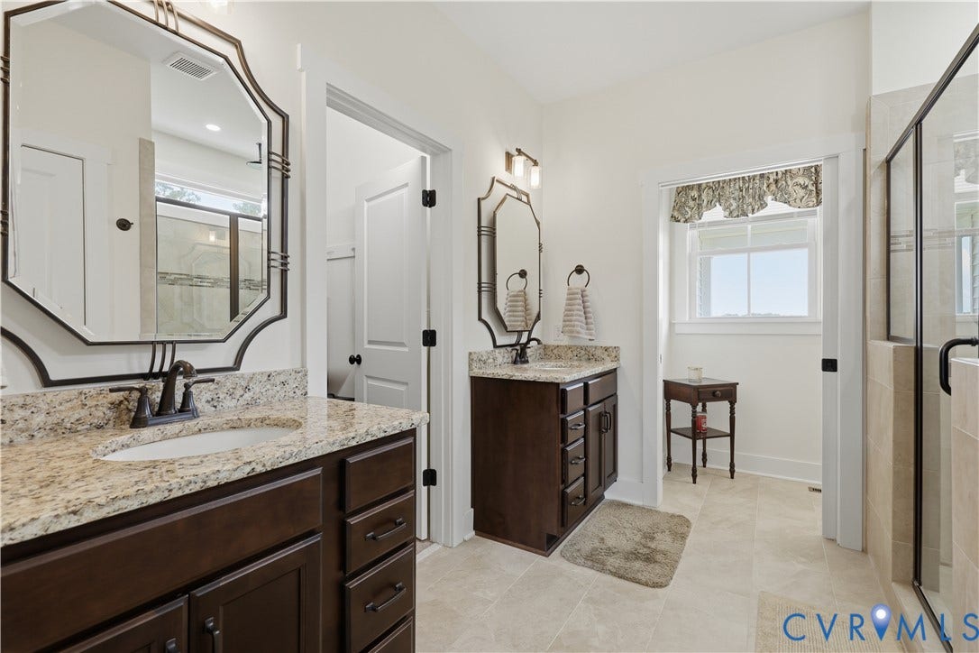 25181 W Soap Stone Rd, Amelia, VA 23083 Double vanity bathroom featuring granite countertops and dark wood cabinetry