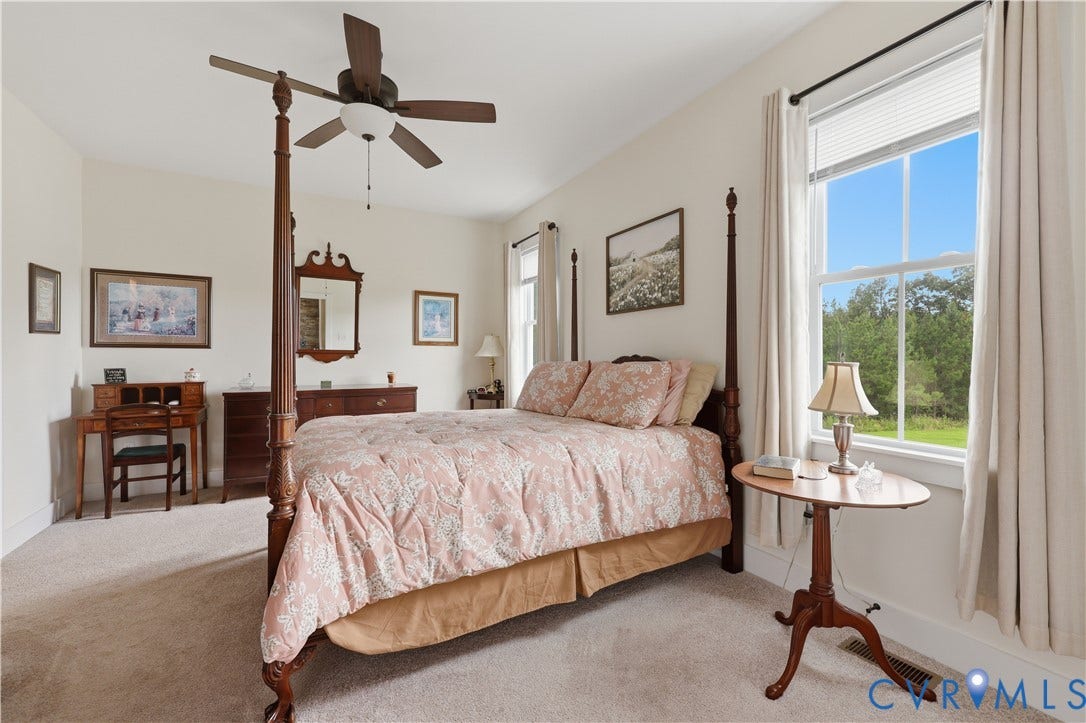25181 W Soap Stone Rd, Amelia, VA 23083 Spacious room featuring neutral carpeting, light-toned walls, and a ceiling fan with integrated lighting
