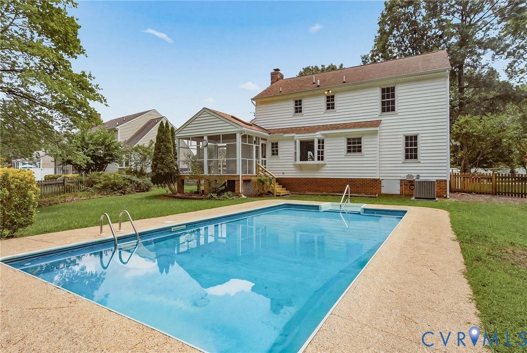 Expansive backyard featuring an in-ground pool, detached storage shed, and plenty of space for entertaining and outdoor enjoyment.