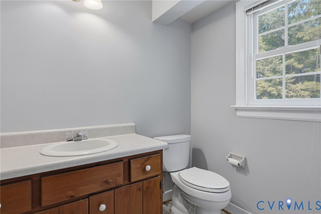 Convenient main-level powder room located just off the family room with easy access for guests and outdoor entertaining.