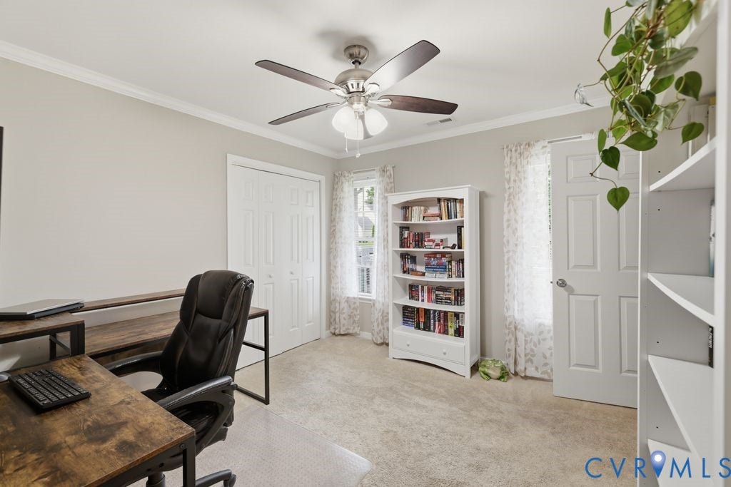 9437 Willow Ridge Drive, Glen Allen, VA 23060 Ceiling fan with light fixture, double bi-fold closet doors, crown molding, built-in shelving, and carpet flooring
