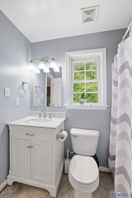 9437 Willow Ridge Drive, Glen Allen, VA 23060 White vanity with undermount sink, stone countertop, and brushed nickel fixtures