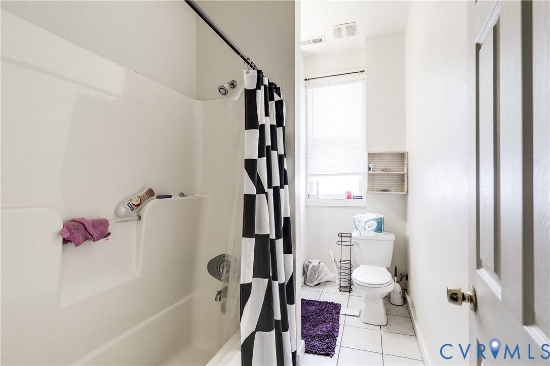 204 Welford Street, Barton Heights, Richmond, VA 23222 Bathroom featuring a white tub-shower combination, white ceramic tile flooring, and a window with blinds