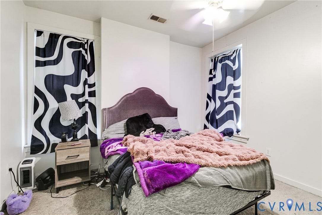 204 Welford Street, Barton Heights, Richmond, VA 23222 Bedroom featuring neutral carpeting, white walls, two windows with white trim, and a ceiling fan with integrated lighting