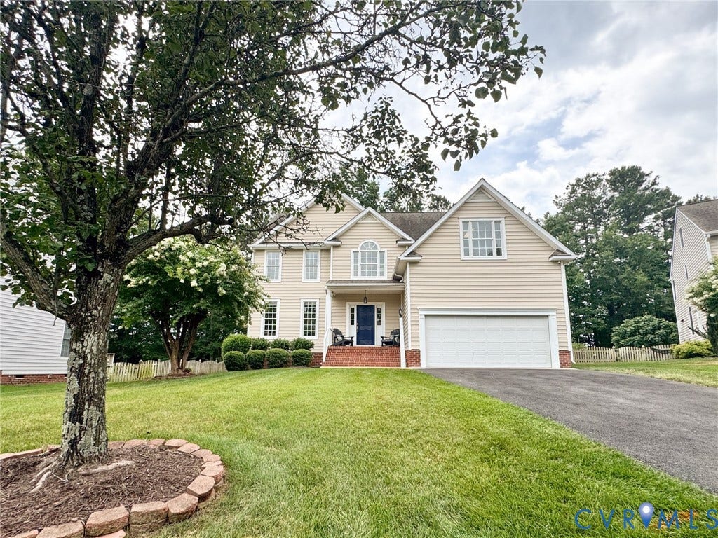 4805 Saddleridge Court, Saddleridge At Twin Hickory, Glen Allen, VA 23059 Traditional two-story residence with a light-toned siding exterior, an attached two-car garage, and a dark blue entry door