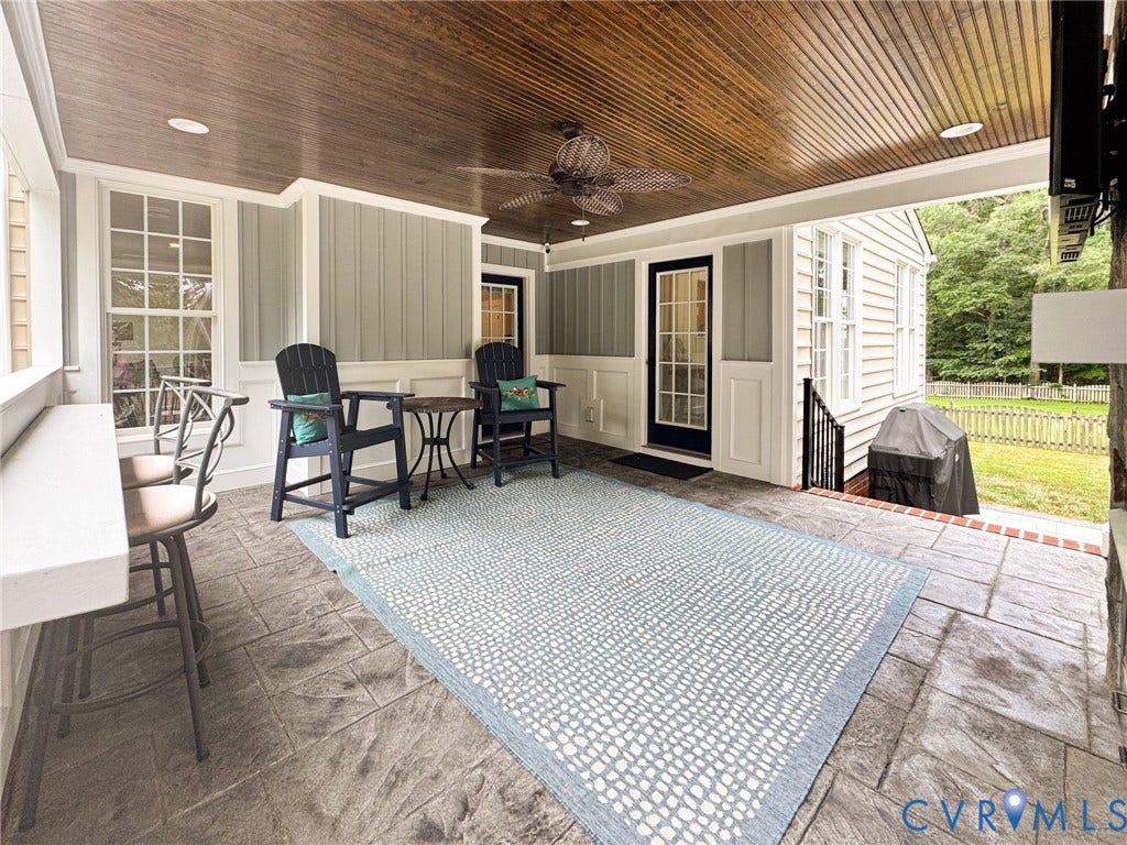 4805 Saddleridge Court, Saddleridge At Twin Hickory, Glen Allen, VA 23059 Covered outdoor porch featuring a wood-panel ceiling with a ceiling fan, recessed lighting, stamped concrete flooring, and a built-in bar counter