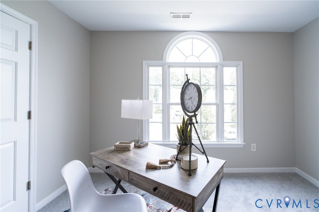 4805 Saddleridge Court, Saddleridge At Twin Hickory, Glen Allen, VA 23059 Bedoom featuring a large arched window, light gray wall paint, and gray carpet flooring