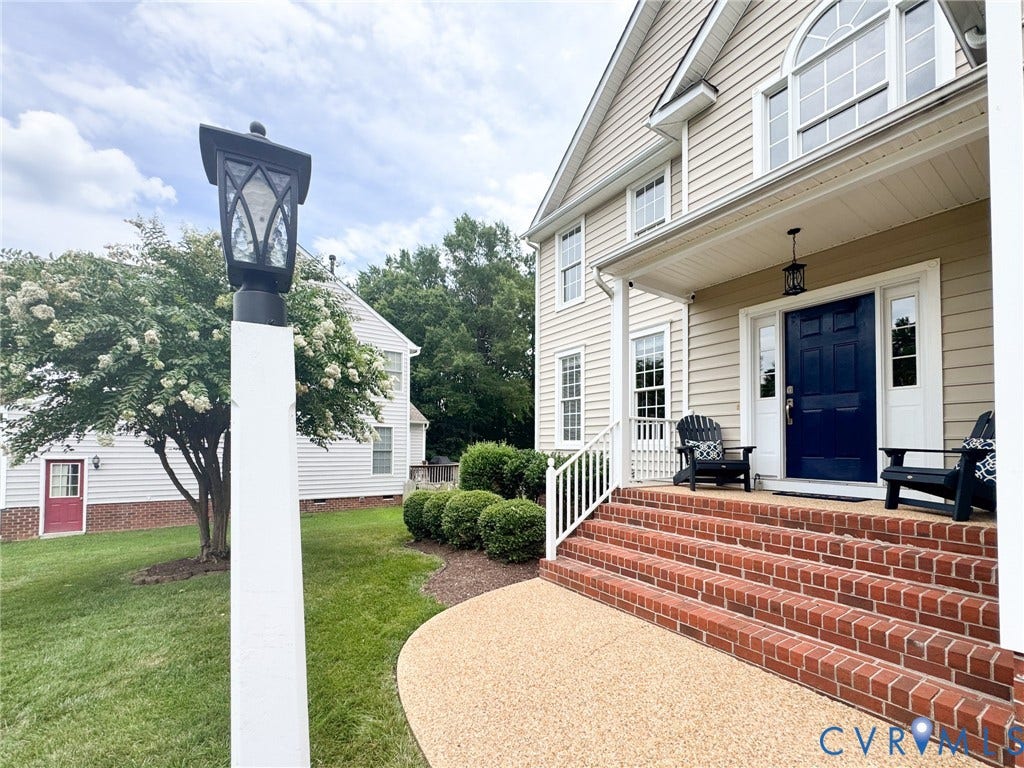 4805 Saddleridge Court, Saddleridge At Twin Hickory, Glen Allen, VA 23059 Welcoming front exterior featuring a covered porch, brick steps, a dark blue entry door, and an arched transom window