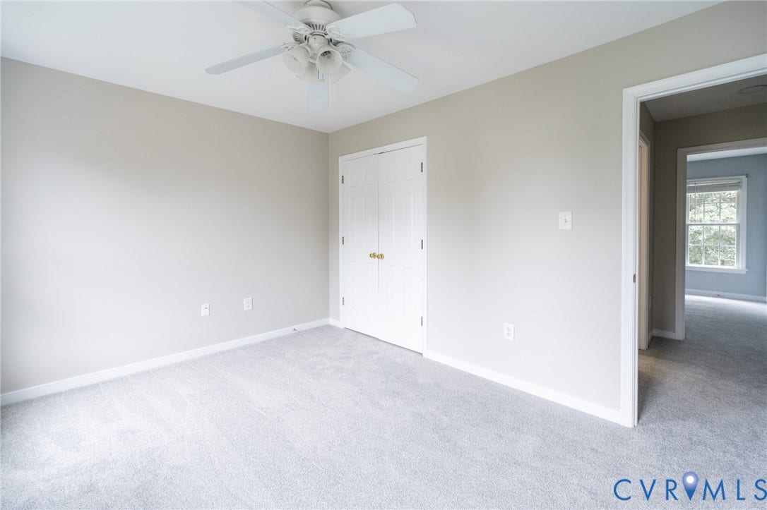 4805 Saddleridge Court, Saddleridge At Twin Hickory, Glen Allen, VA 23059 Neutral-toned room featuring light gray carpeting, white baseboards, and a ceiling fan with integrated lighting