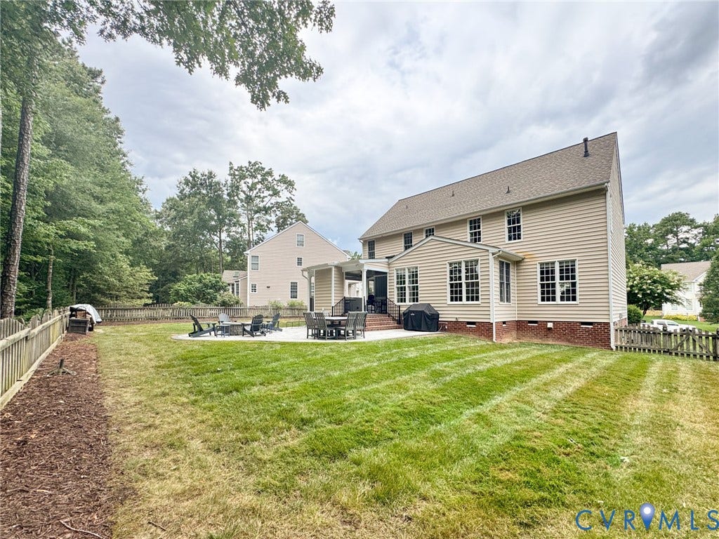 4805 Saddleridge Court, Saddleridge At Twin Hickory, Glen Allen, VA 23059 Spacious backyard featuring a large stone patio, an additional covered porch, mature perimeter trees, and a wood picket fence