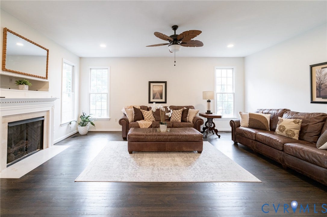 4805 Saddleridge Court, Saddleridge At Twin Hickory, Glen Allen, VA 23059 Spacious living area featuring dark wood-flooring, a white mantel fireplace, multiple windows, recessed lighting, and a ceiling fan