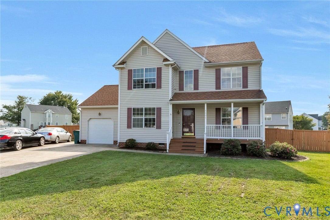 1601 Varina Station Court, Henrico, VA 23231 Two-story residence featuring light-colored siding, a covered front porch, and an attached garage