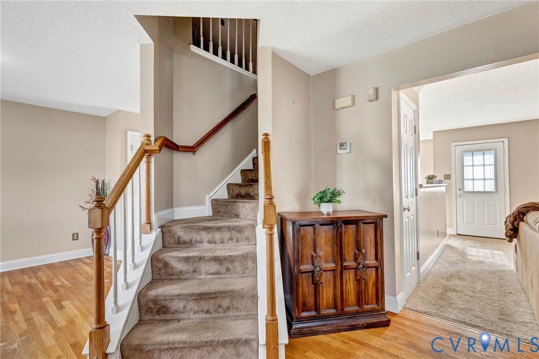 1601 Varina Station Court, Henrico, VA 23231 Staircase with carpeted treads, wood-finish handrail, and white balusters