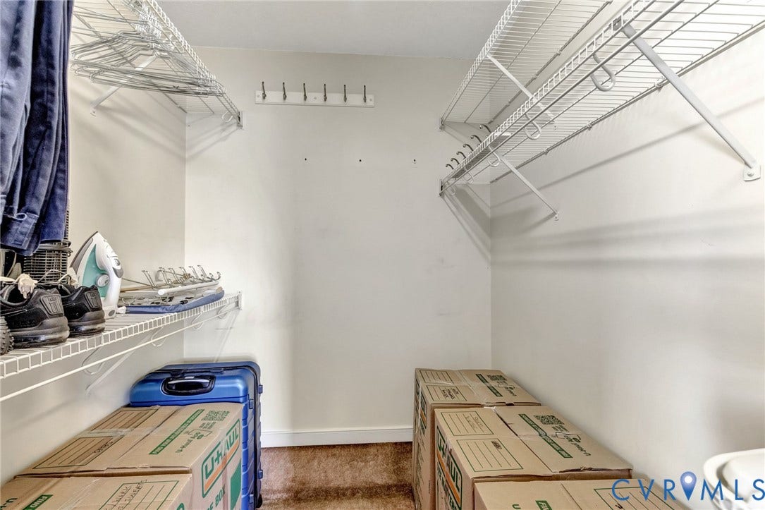 1601 Varina Station Court, Henrico, VA 23231 White wire shelving system, integrated hanging rods, and wall-mounted hooks