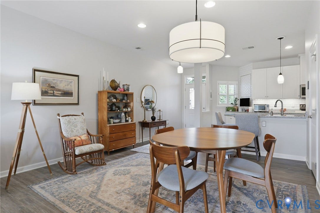 10653 Braden Parke Drive, Midlothian, VA 23832 Open-concept dining and kitchen area featuring a drum pendant light fixture, recessed lighting, and wood-finish flooring