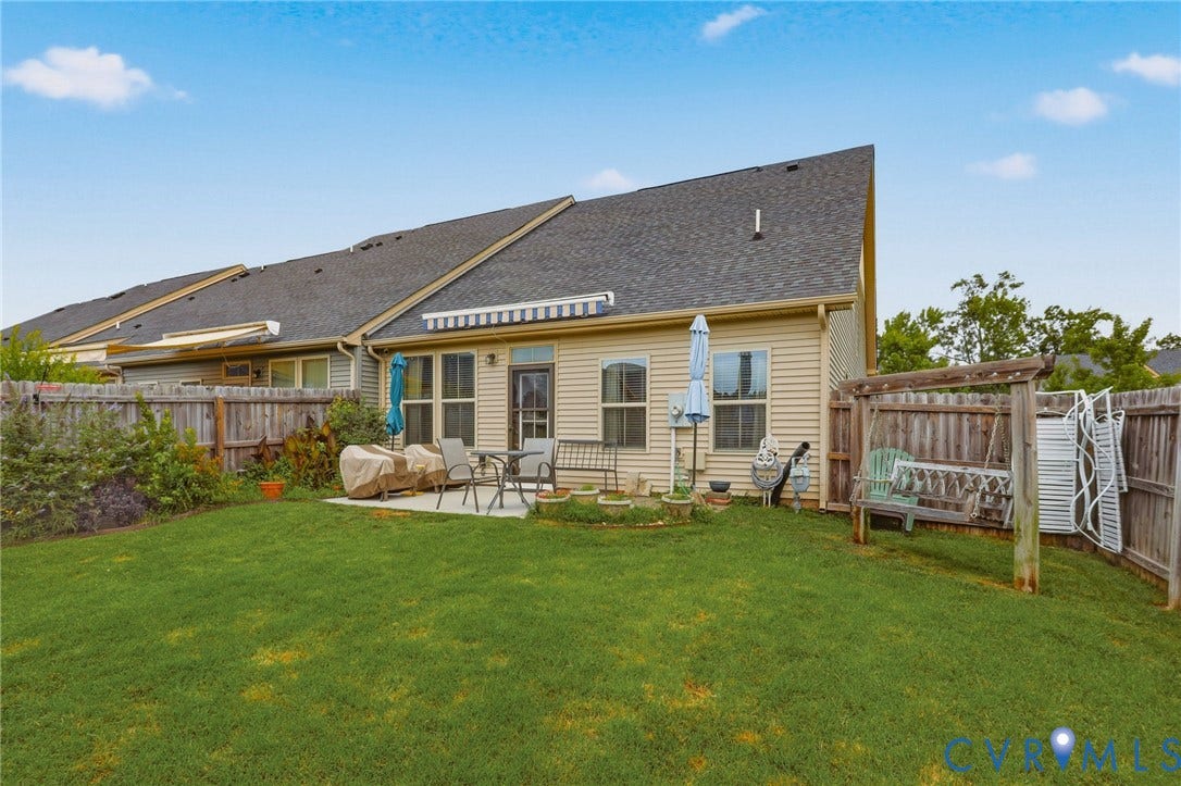 10653 Braden Parke Drive, Midlothian, VA 23832 Private backyard featuring a concrete patio, wood fencing, and a pergola structure