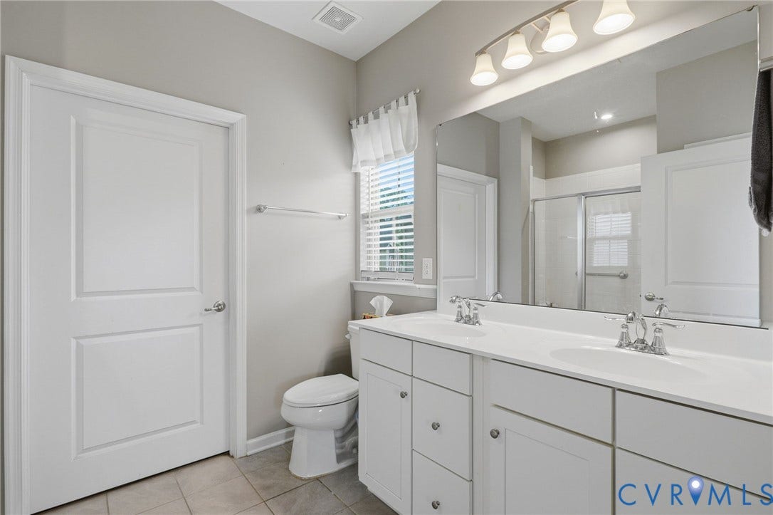 10653 Braden Parke Drive, Midlothian, VA 23832 Dual white vanity with undermount sinks and chrome fixtures