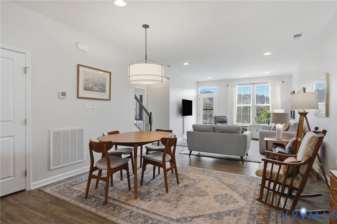 10653 Braden Parke Drive, Midlothian, VA 23832 Open-concept living space featuring wood-finish flooring, recessed lighting, and a drum pendant light fixture