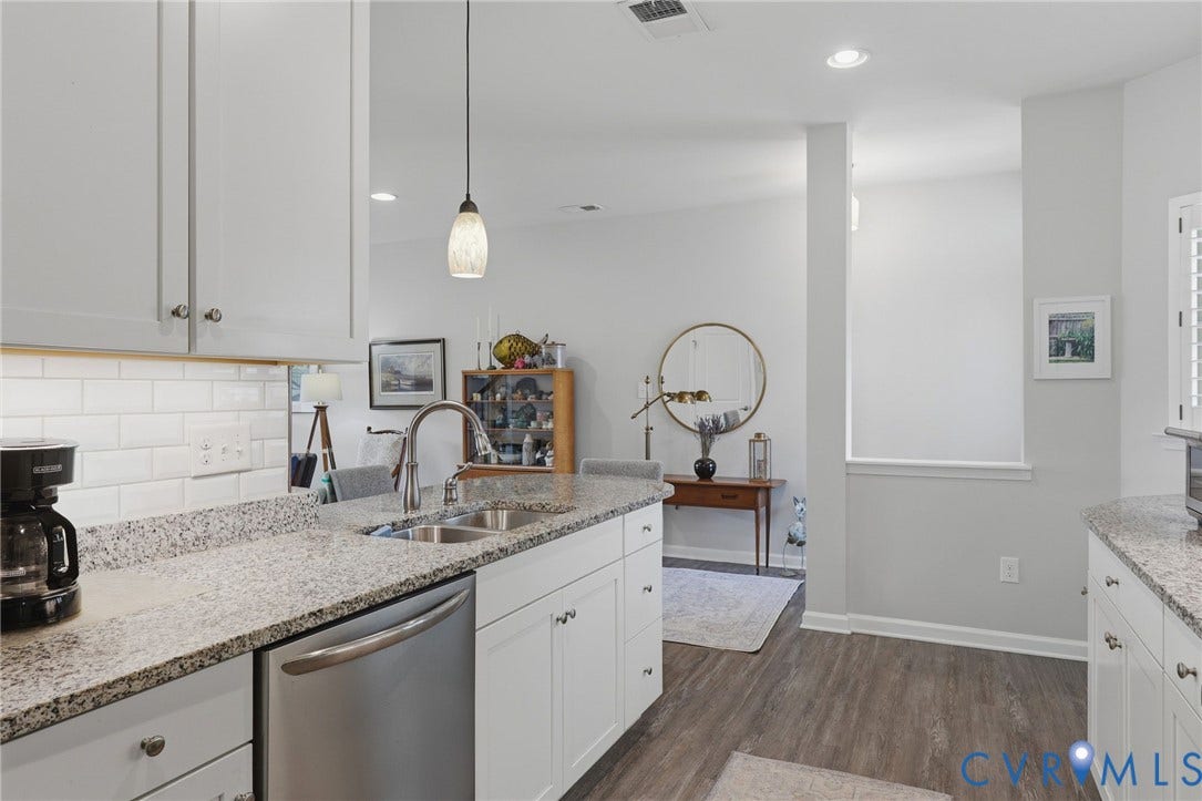 10653 Braden Parke Drive, Midlothian, VA 23832 Kitchen featuring light-toned cabinetry, a stainless steel dishwasher, a double basin sink with a high-arc faucet, and granite countertops