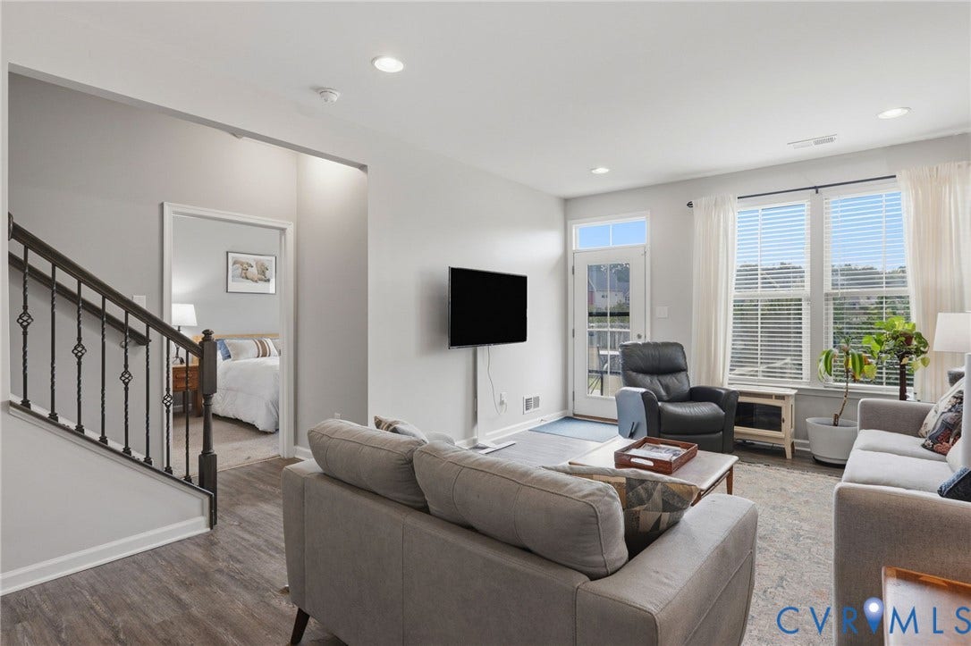 10653 Braden Parke Drive, Midlothian, VA 23832 Spacious living area featuring wood-finish flooring, recessed lighting, and a neutral color palette