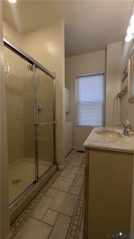 1620 Grove Avenue, #1, Richmond, VA 23220 Bathroom featuring a shower with sliding glass doors, a vanity with an integrated sink, and tile flooring with a decorative border