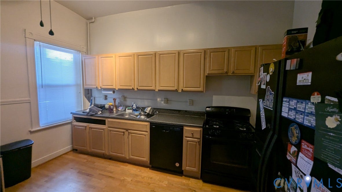 1620 Grove Avenue, #1, Richmond, VA 23220 Kitchen featuring wood-finish flooring, a double basin sink, and a black range