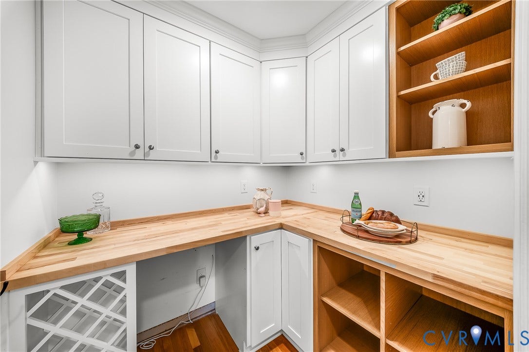 Custom Built Pantry with Electric Outlets, cabintry, wine refrigerator space.