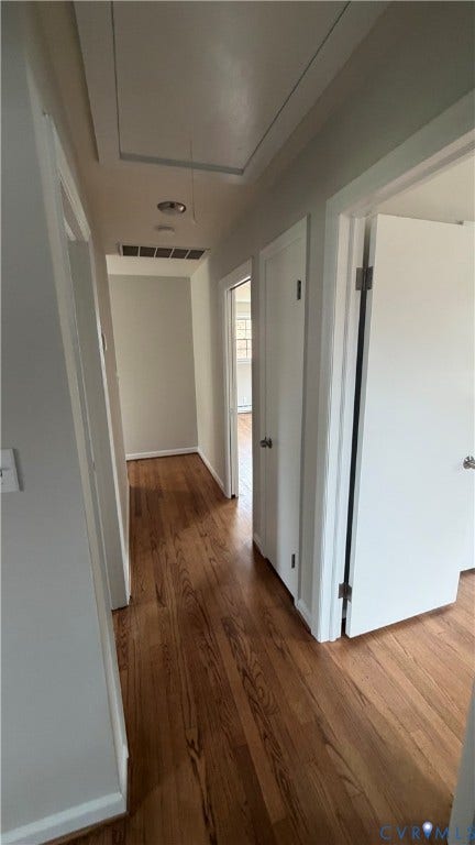 207 Mac Arthur Avenue, Gregory, Colonial Heights, VA 23834 Hallway featuring wood-finish flooring, light-toned wall paint, white trim, and white doors