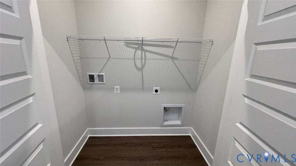 Washroom with hookup for a washing machine, dark hardwood / wood-style floors, and hookup for an electric dryer