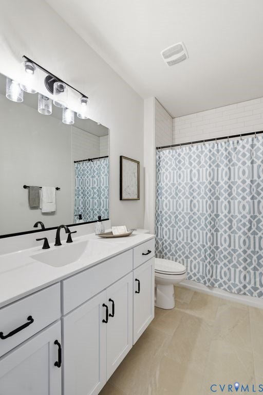 White vanity with matte black hardware, integrated sink, and matching matte black faucet